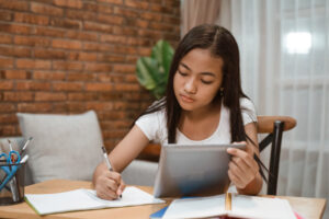 Portrait,Of,Young,Teenager,Junior,High,School,Student,Studying,At icas practice child studying for exam