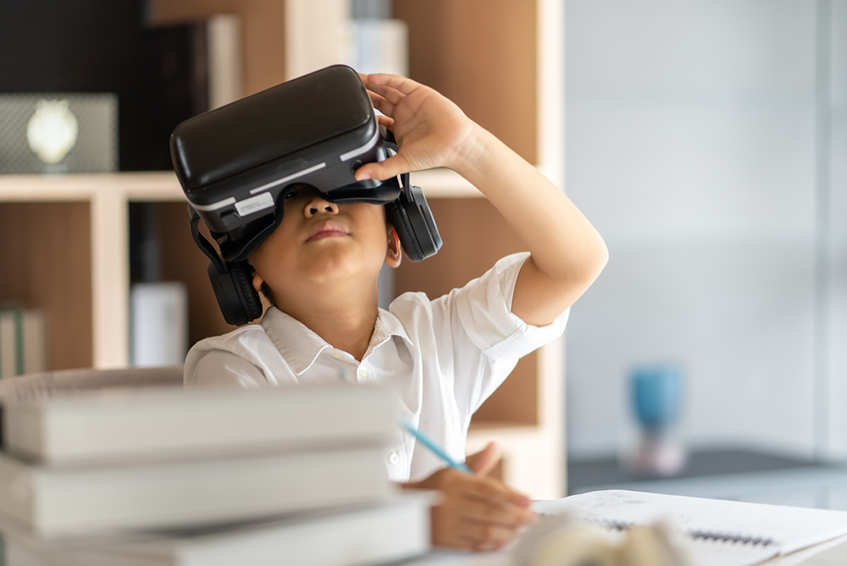 School student looking through a VR headset