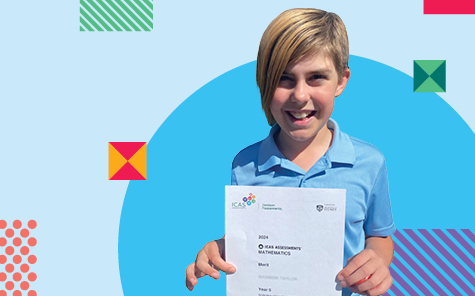 child holding icas school competition certificate